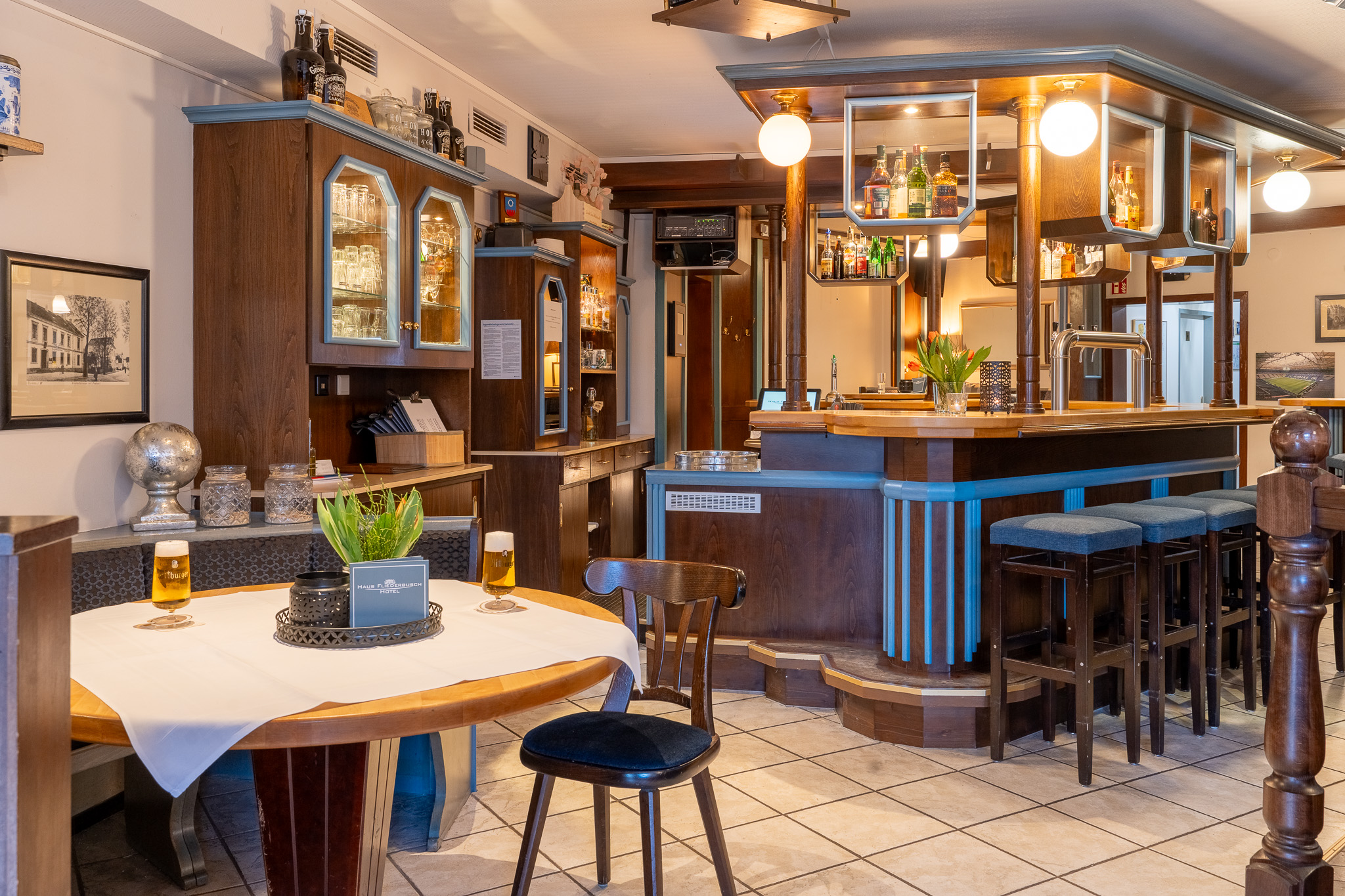 Historic Wirtschaft at Haus Fliederbusch with wooden bar and cosy atmosphere